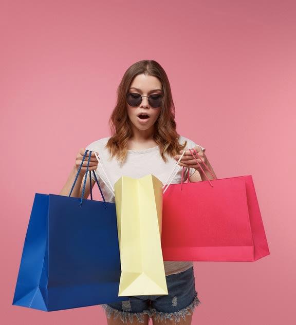 A woman doing shopping and being unable to resist impulse buying