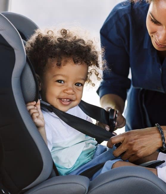 A kids secured safely in a car booster seat